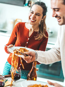 people eating spaghetti