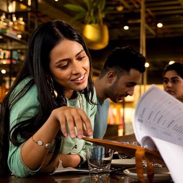 woman looking at menu