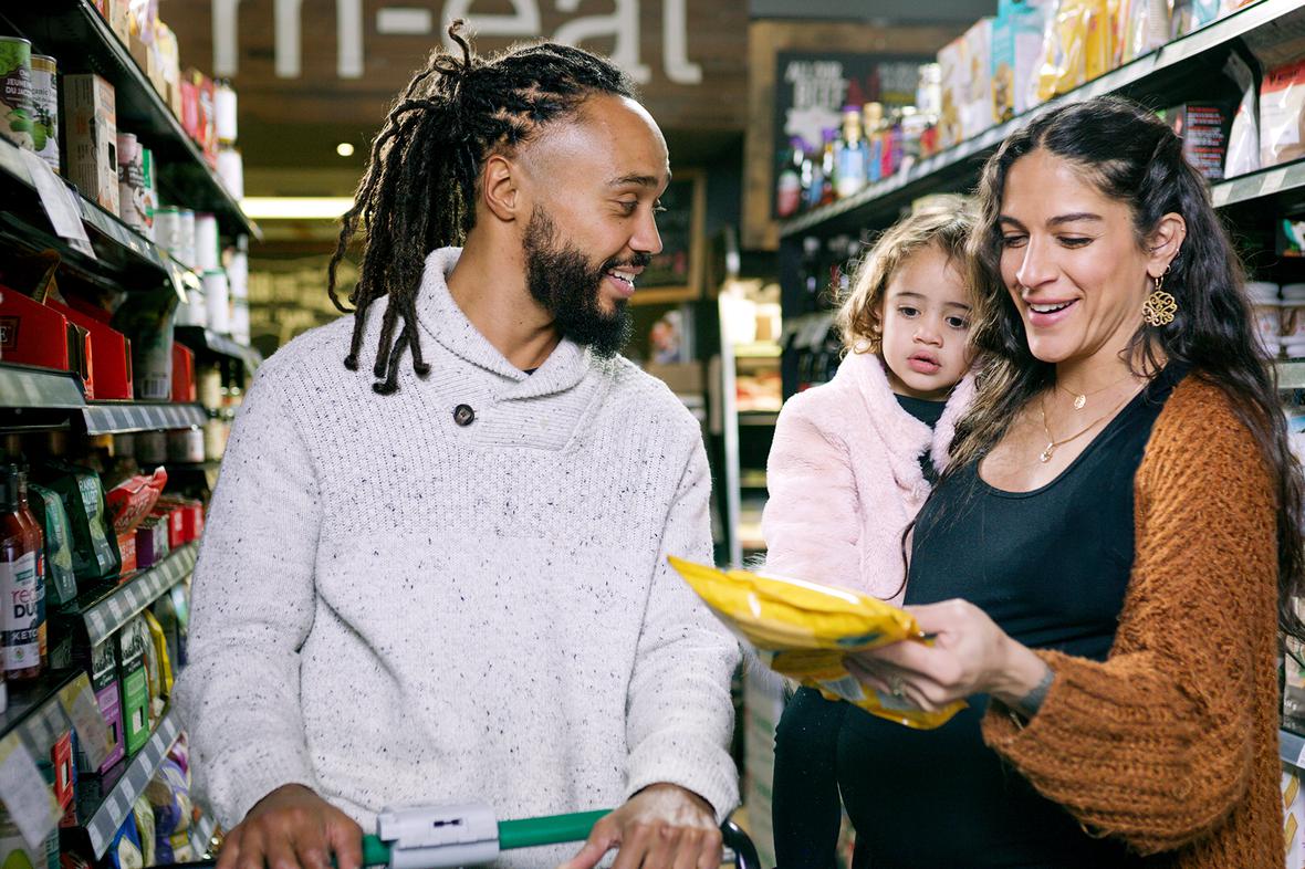 family shopping for groceries in supermarket