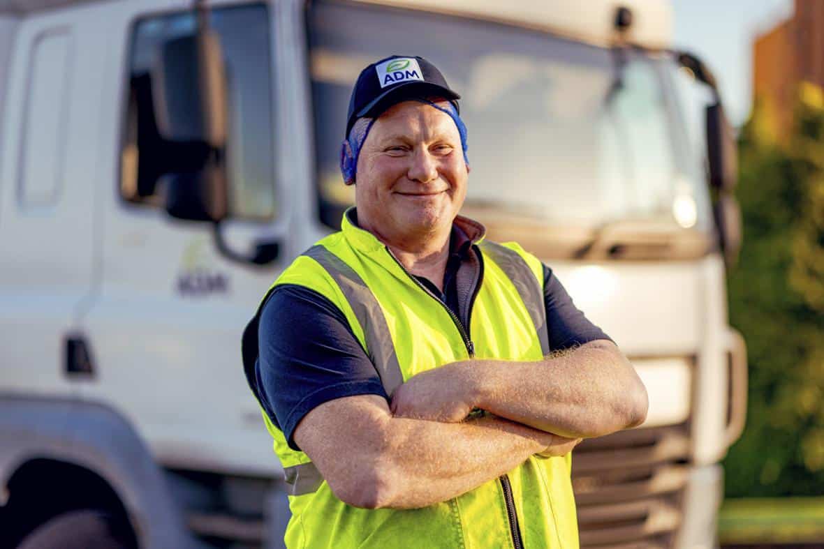 Close up of man smiling in front of tanker truck 20211216 0368 v1 lores