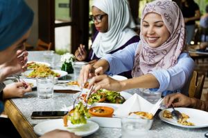 women friends dining together with happiness GettyImages 1040288342 min