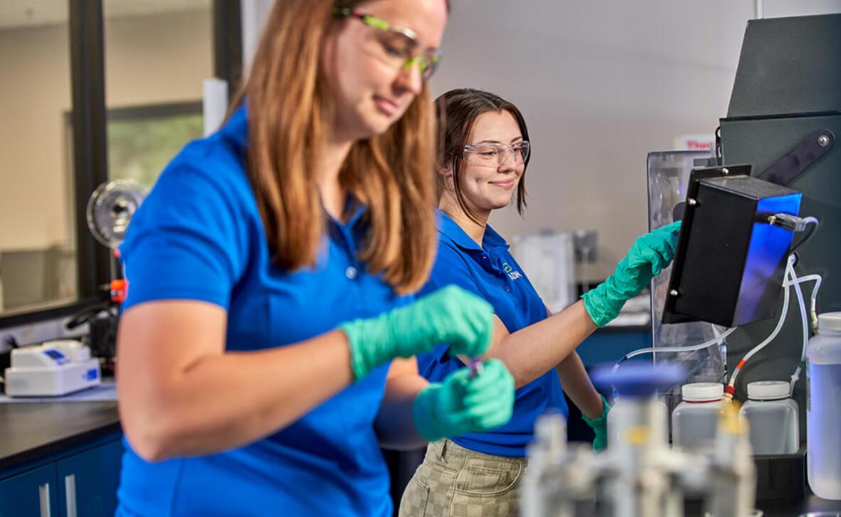 Two people working in a lab setting