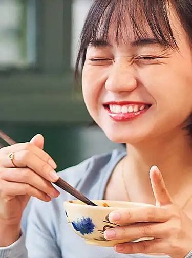 asian woman eating rice bowl mobile
