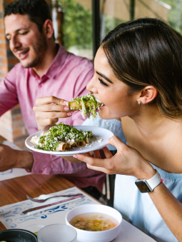 A couple eating plant based protein food at the table