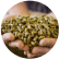 A farmer's hands holding animal feed