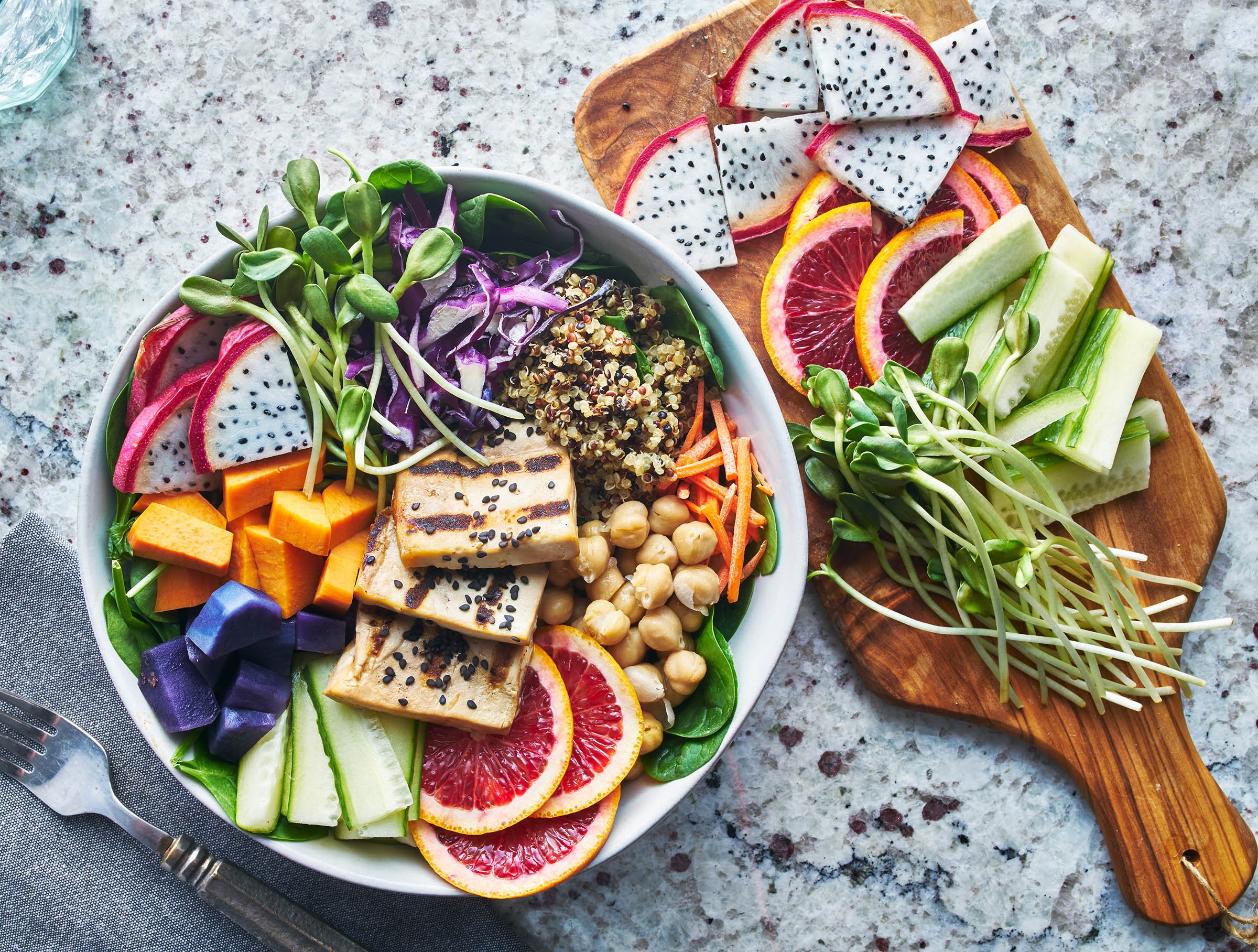 A colorful plant-based meal with fruit, vegetables and protein