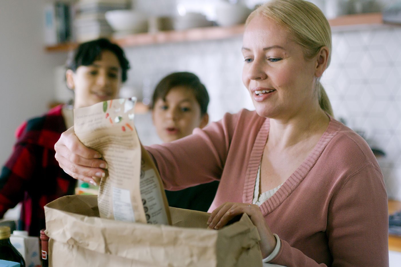 Mother-and-sons-unpacking-grocery-bags-in-their-kitchen_Vancouver-06.jpg