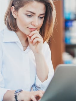 woman looking at laptop