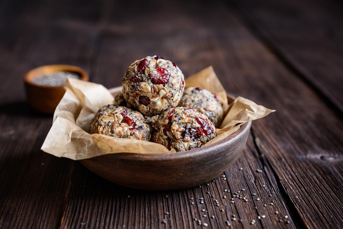 Healthy oatmeal energy snack bite balls with chia seeds, cranberries, coconut, flax seeds and honey