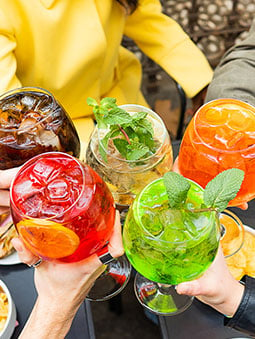 Colorful drinks seen from above on an inviting wooden table