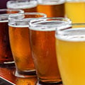 Cider glasses with many shades of yellow on an inviting table