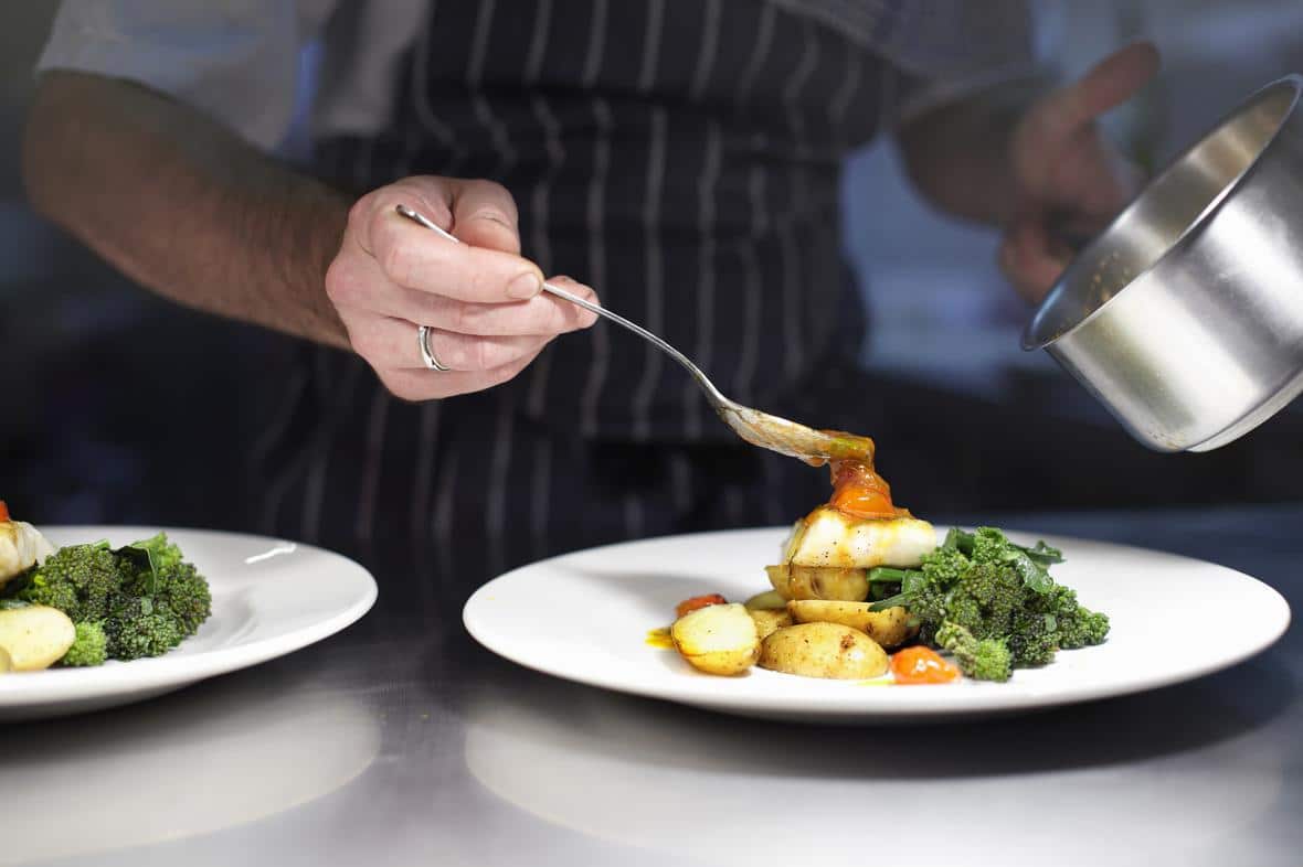 A chef carefully preparing a delicious dinner