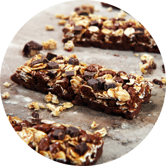 A close-up of freshly baked protein bars on a baking sheet.