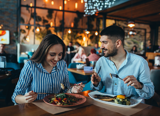 A couple eating at a restaurant