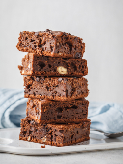 A stack of brownies on a plate