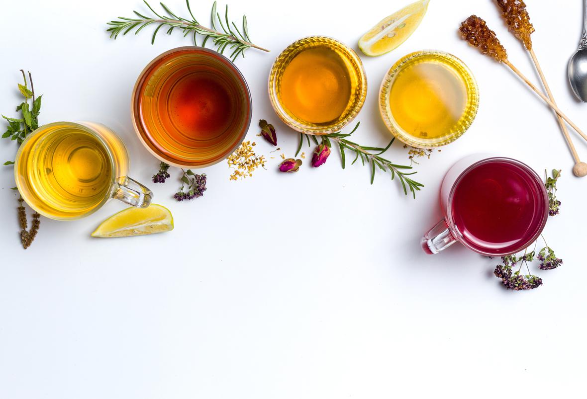 Variety of tea surrounded by natural ingredients