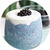 A glass of a blue spirulina and blackberry smoothie