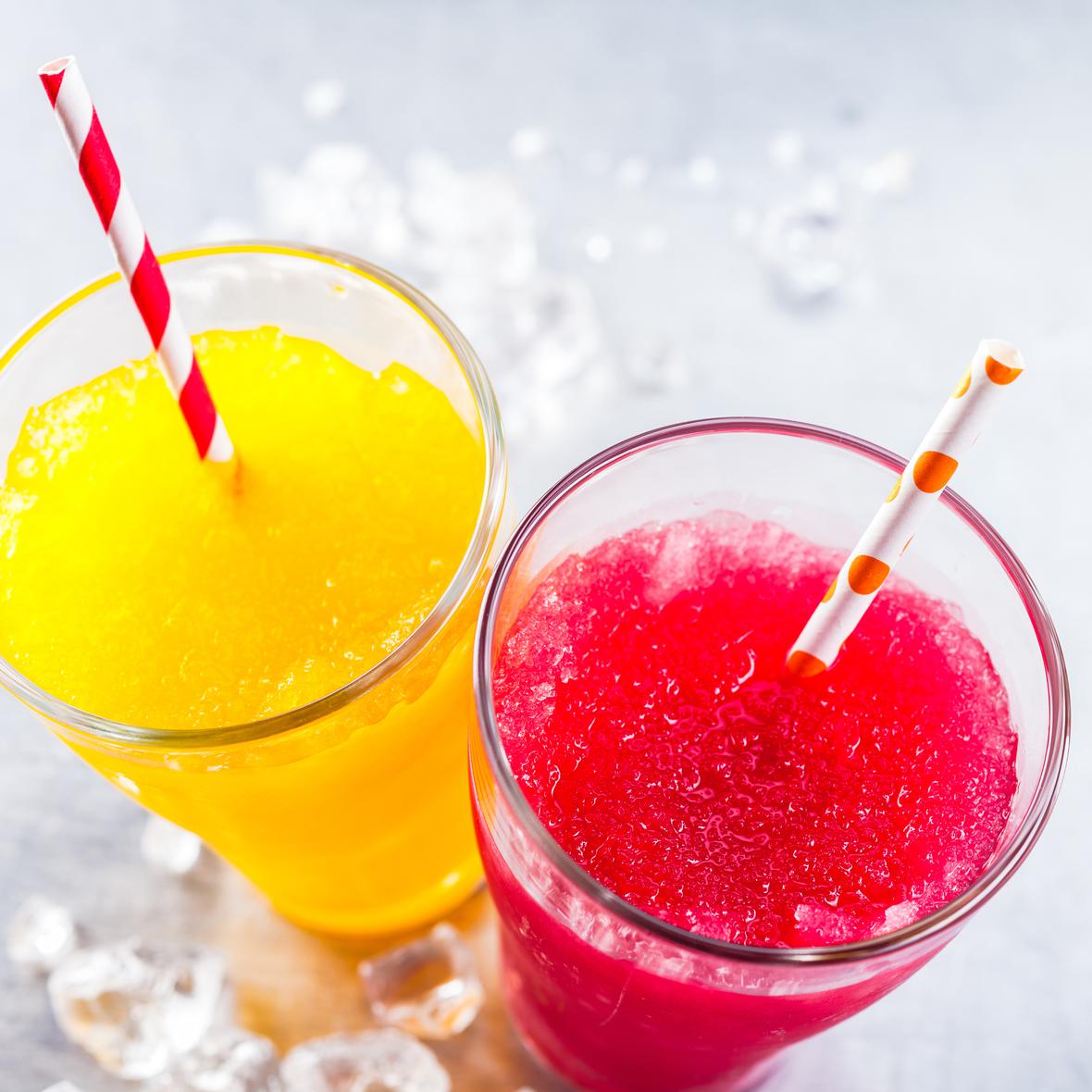 Two colorful drinks with straws