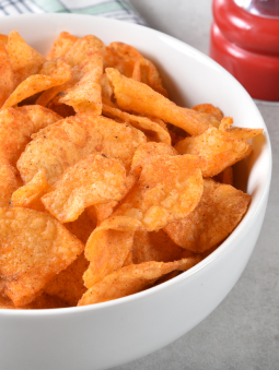 A white bowl of barbecue chips