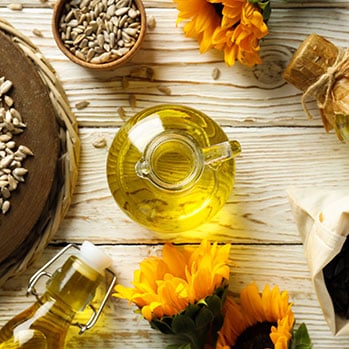 Sunflower seeds and sunflower oil on a table 
