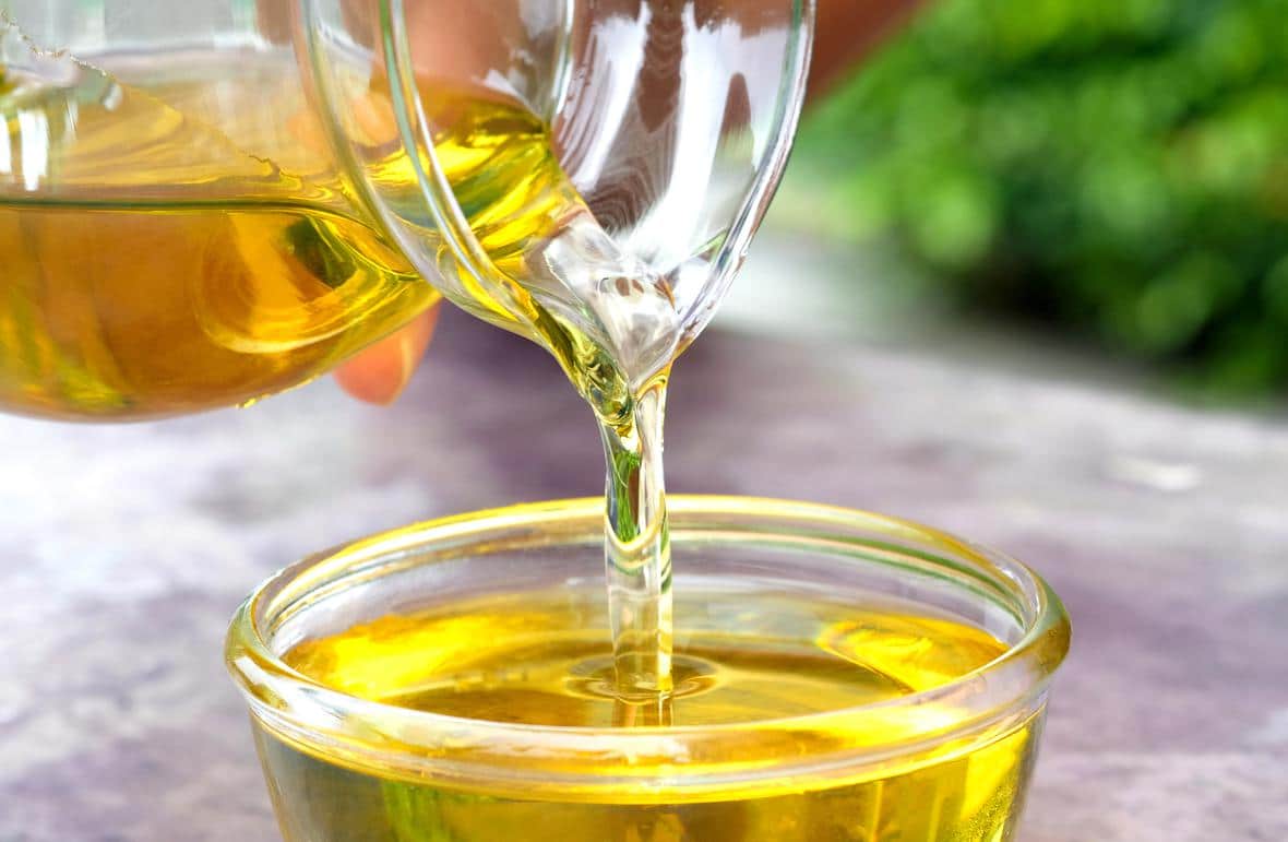 Oil being poured into a serving dish