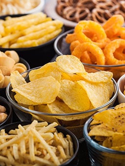 Bowls of different savory snacks