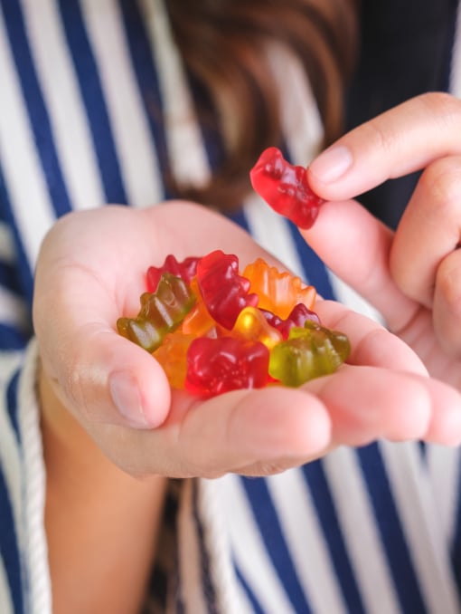 A close-up of a gummy bears in someone’s hand