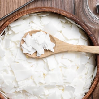 An overhead view of fat flakes in a bowl