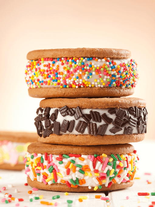 Vanilla ice cream sandwiches with rainbow and chocolate sprinkles