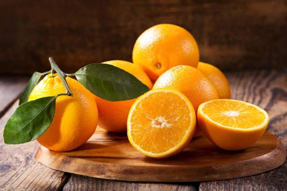 Oranges in a basket on a table