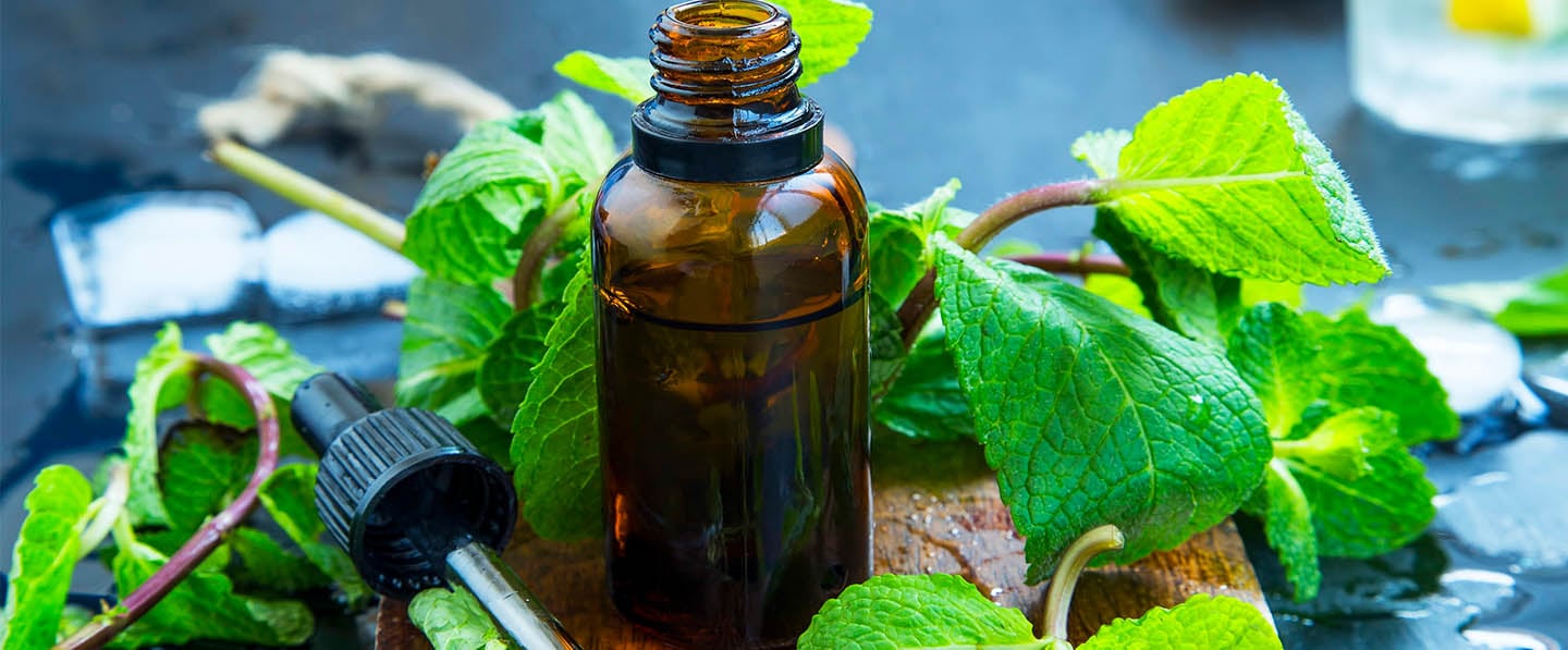 Mint Essential Oil bottle with Mint leaf