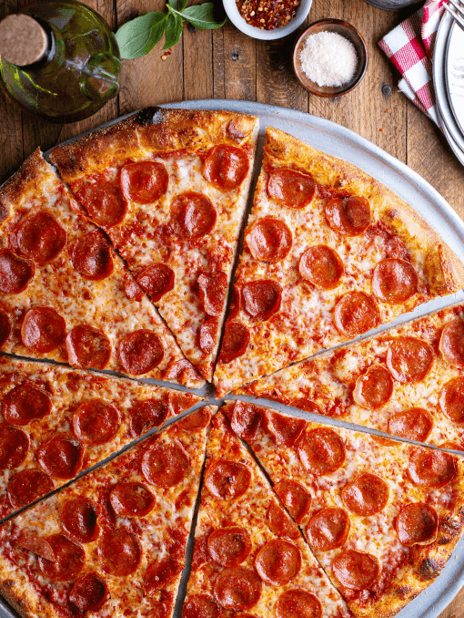 A sliced pepperoni pizza with a whole wheat flour crust