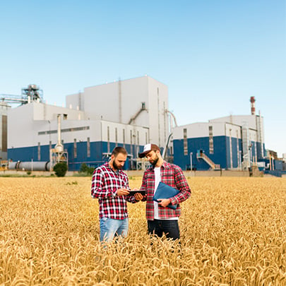 Male wheat growers outside facility 405x405