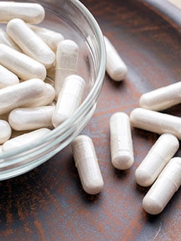 White supplement capsules