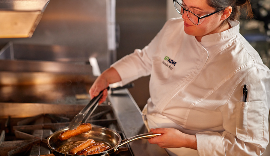 An ADM chef cooking in a kitchen