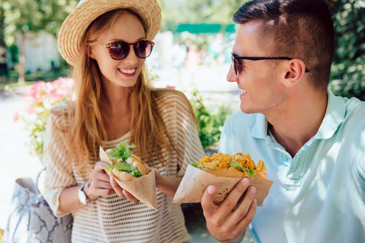 Happy couple enjoying plant-based protein sandwich