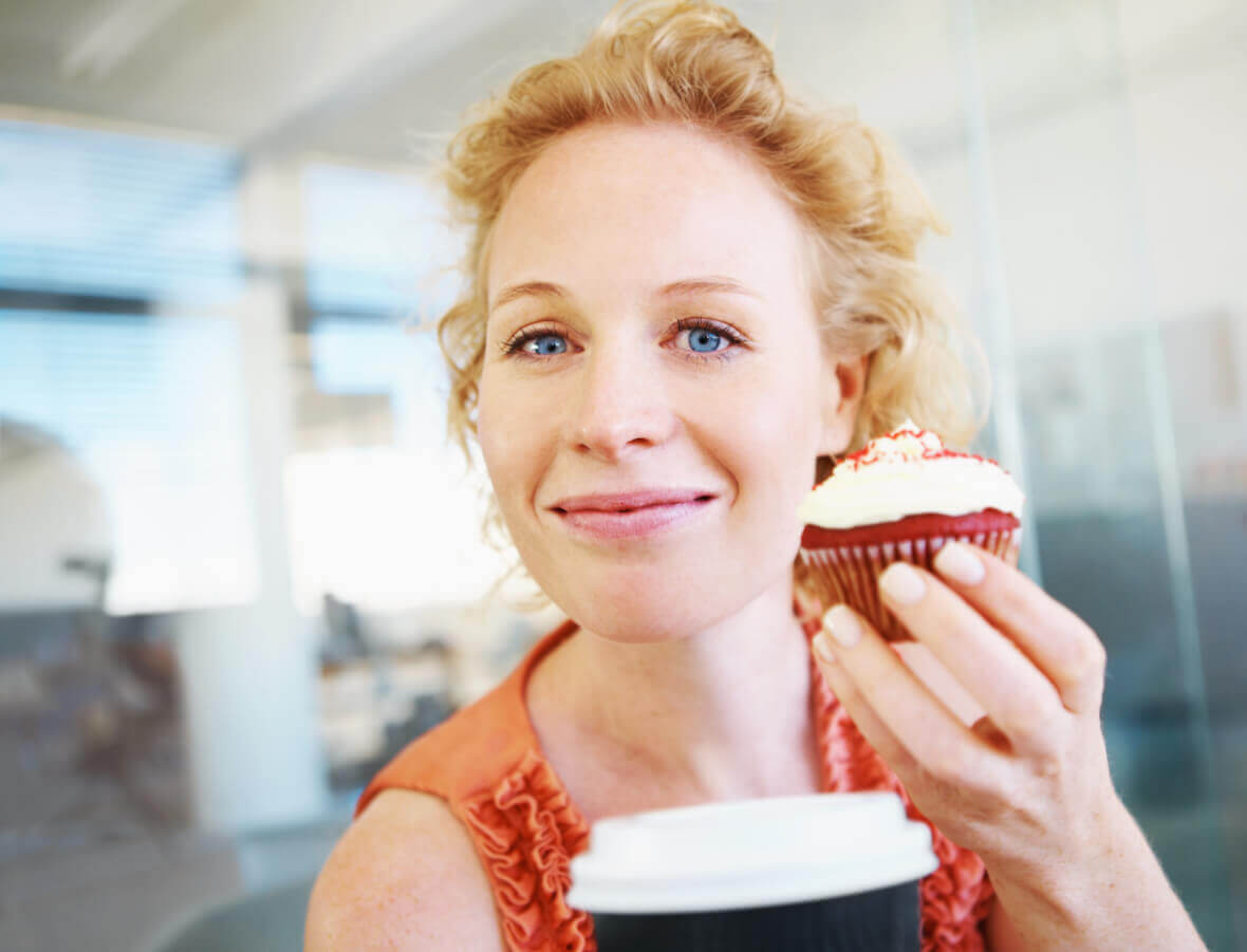 Woman with a delicious cupcake