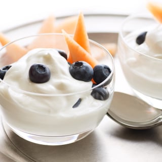 Small bowls of yogurt with fruit