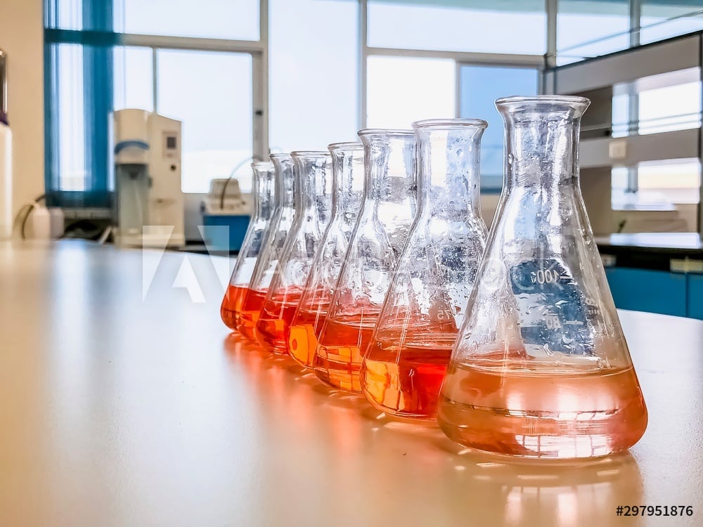 A row of solvents in beakers