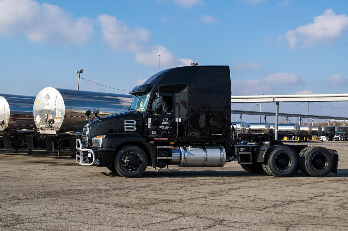 ADM truck with liquid tanks in the background