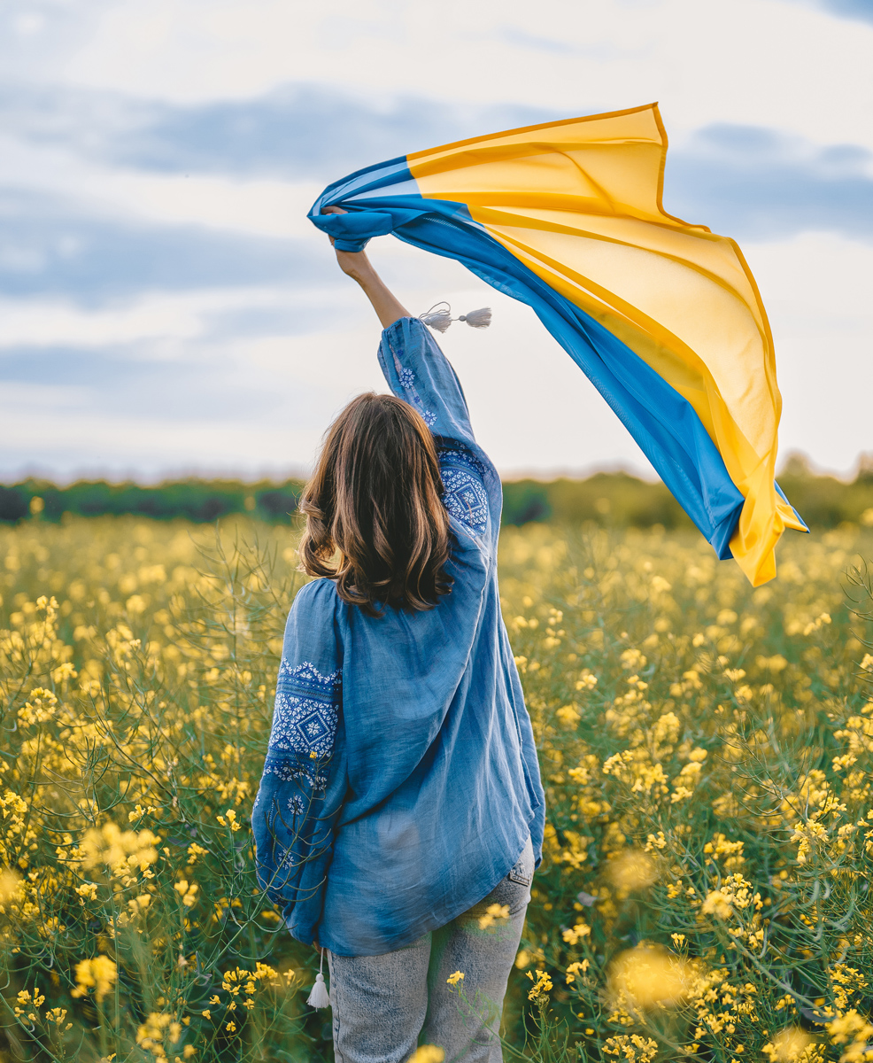 commitments ukrainian woman holding ukrainian flag