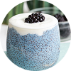 A glass of a blue spirulina and blackberry smoothie