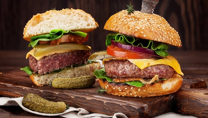 Burger split in half with knife