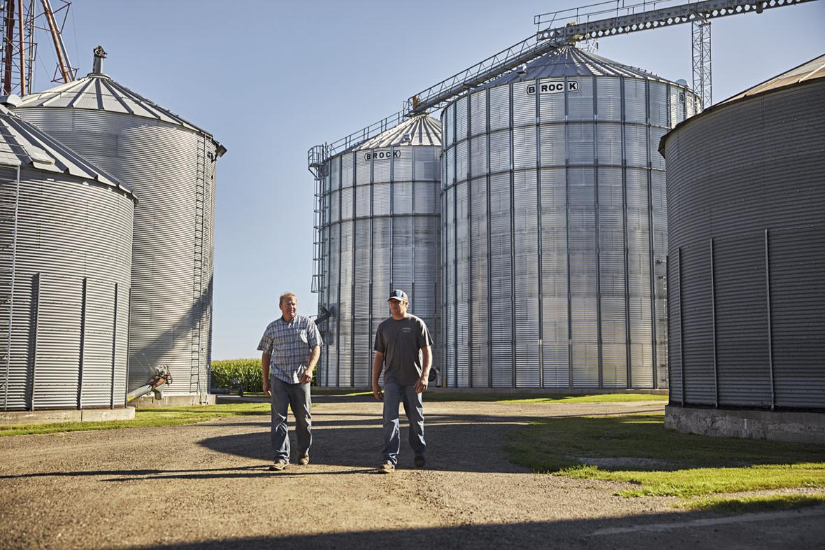Men walking thru silos.