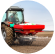 A farmer fertilizing a field