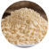 Soybean meal in a bowl with raw soybeans around
