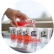 A pink reduced sugar soda being poured into a line of several small ADM branded tasting glasses.