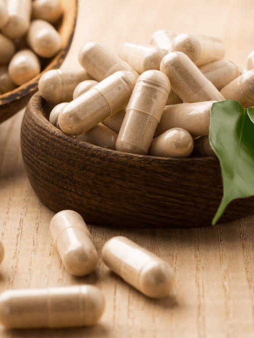 Dietary supplement capsules in a bowl