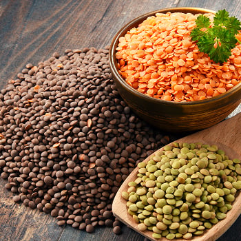 A bowl of lentils and a pile of beans