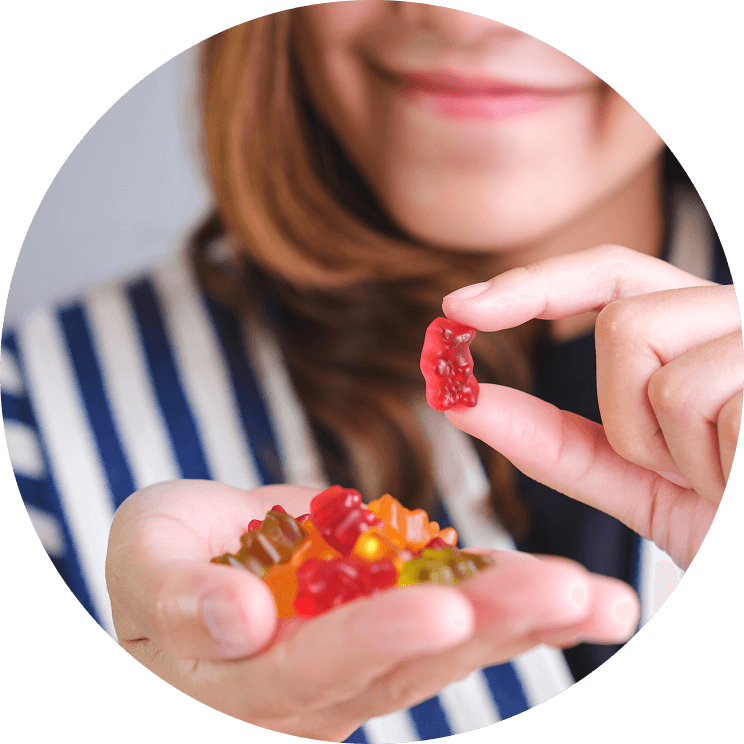A person holding gummy bears